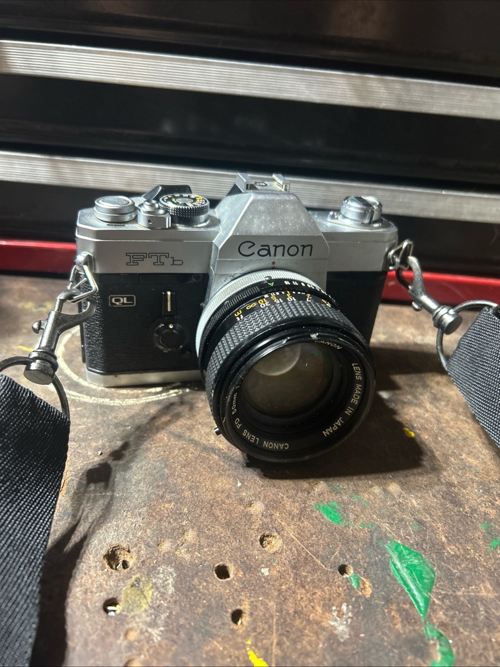 Canon Vintage 35mm SLR Camera in Silver and Black with Attached Lens